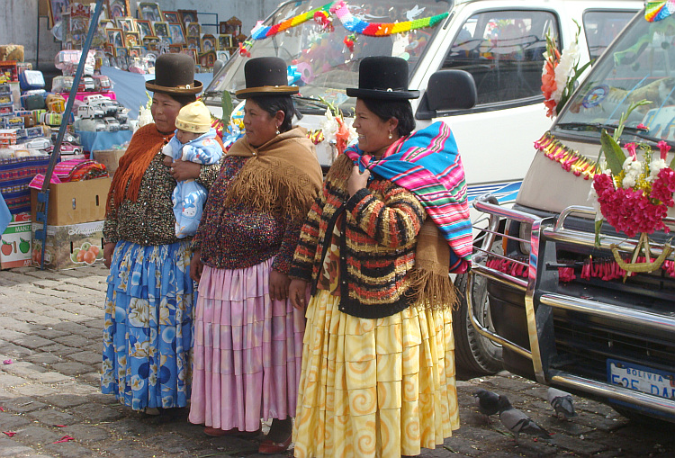 The women proudly pose before the blessed cars in Copacabana