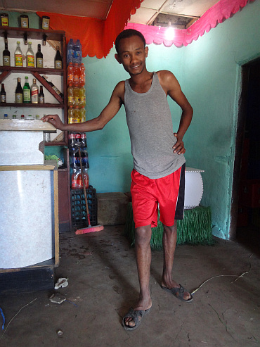 Waiter of a sublime restaurant in a village on the plateau