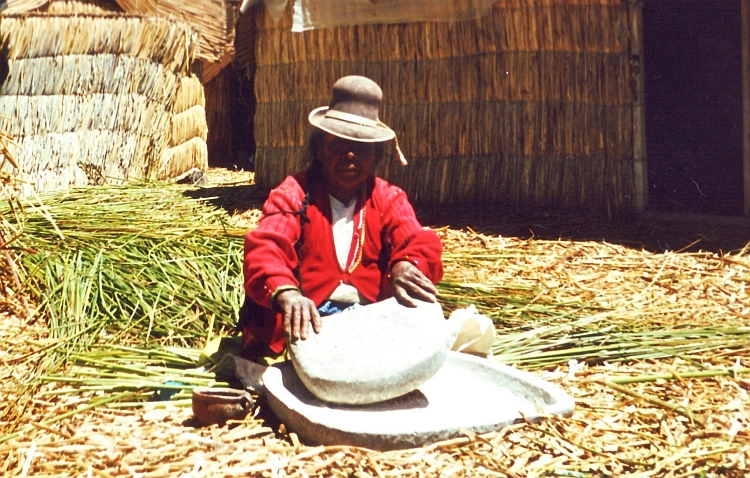 Woman on a floating reed island, Lake Titicaca